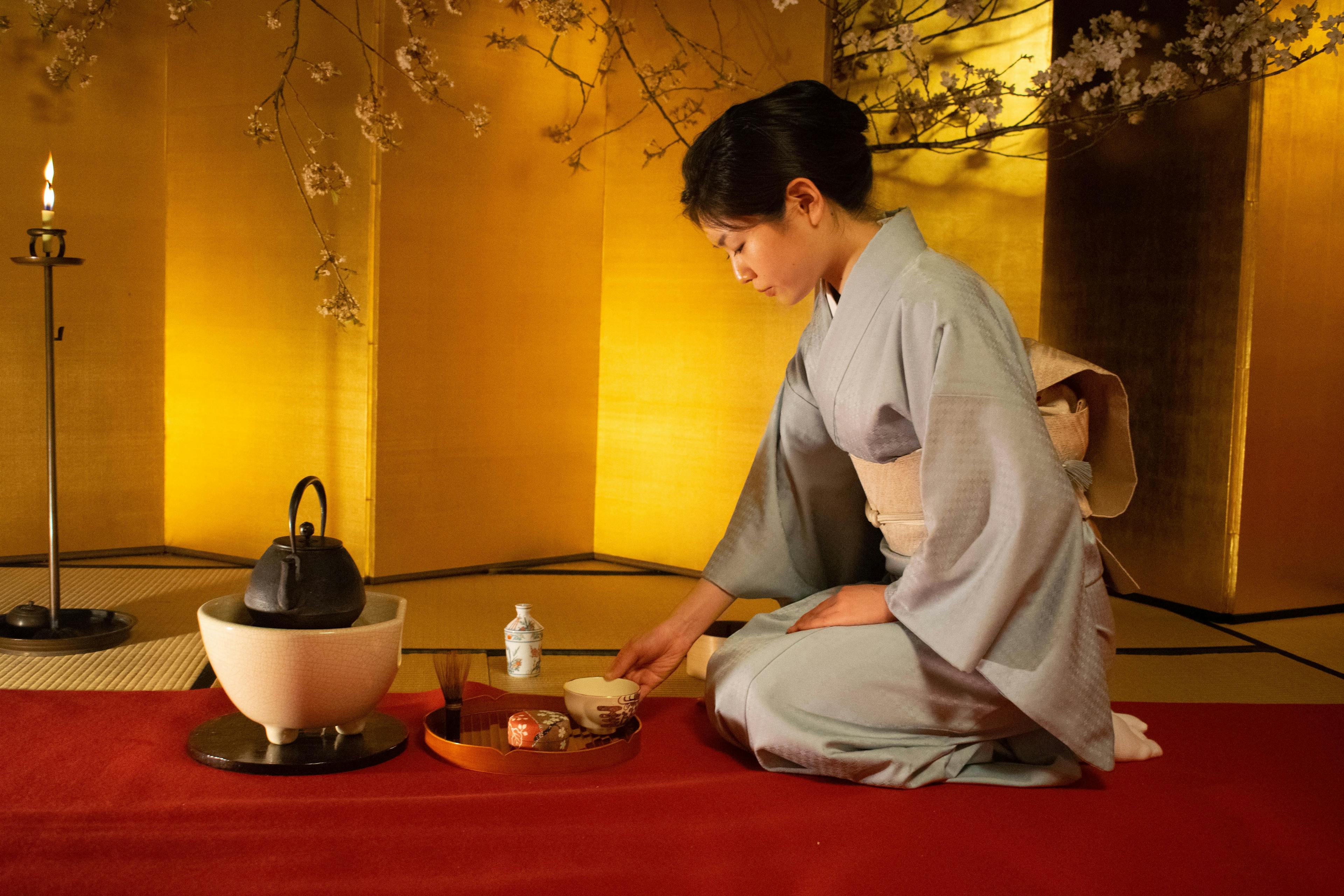 Woman performing a tea ceremony in Kyoto Japan.