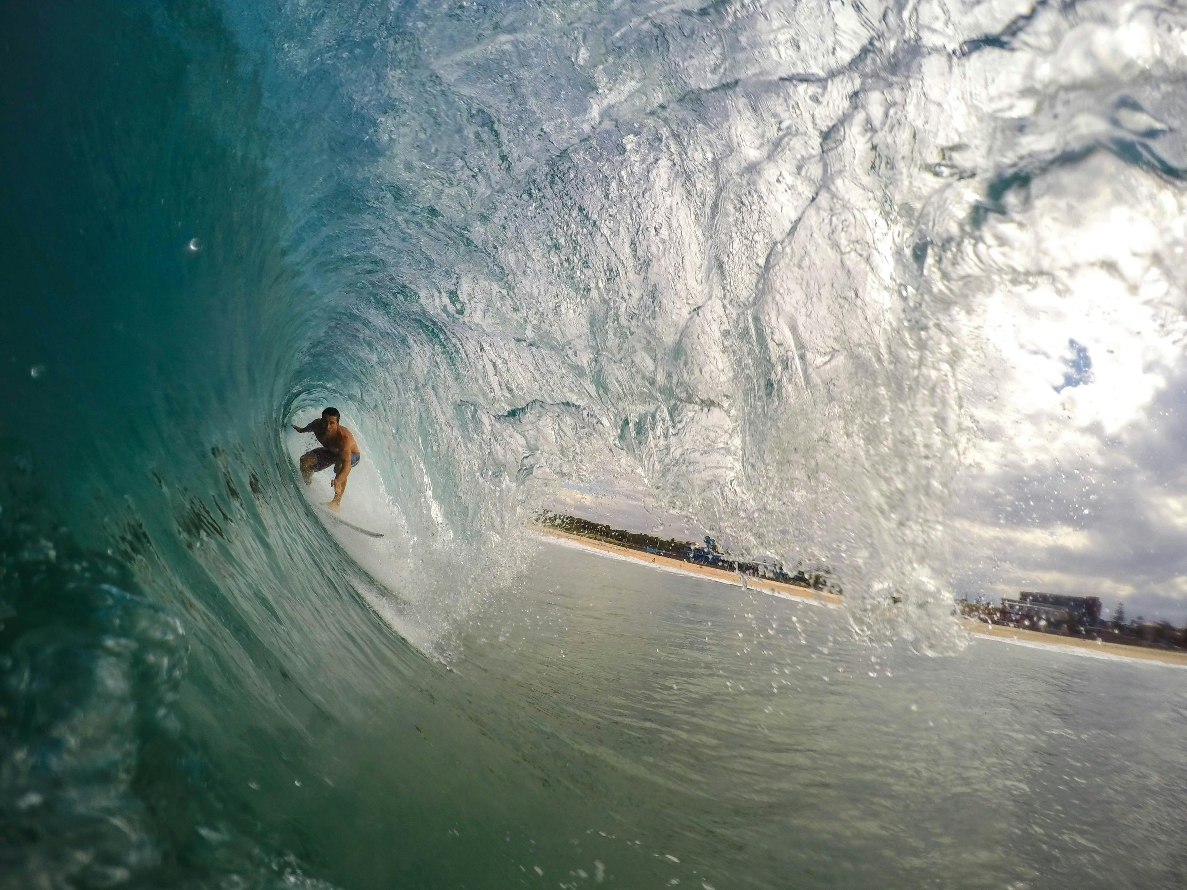 Man surfing the waves in Bali